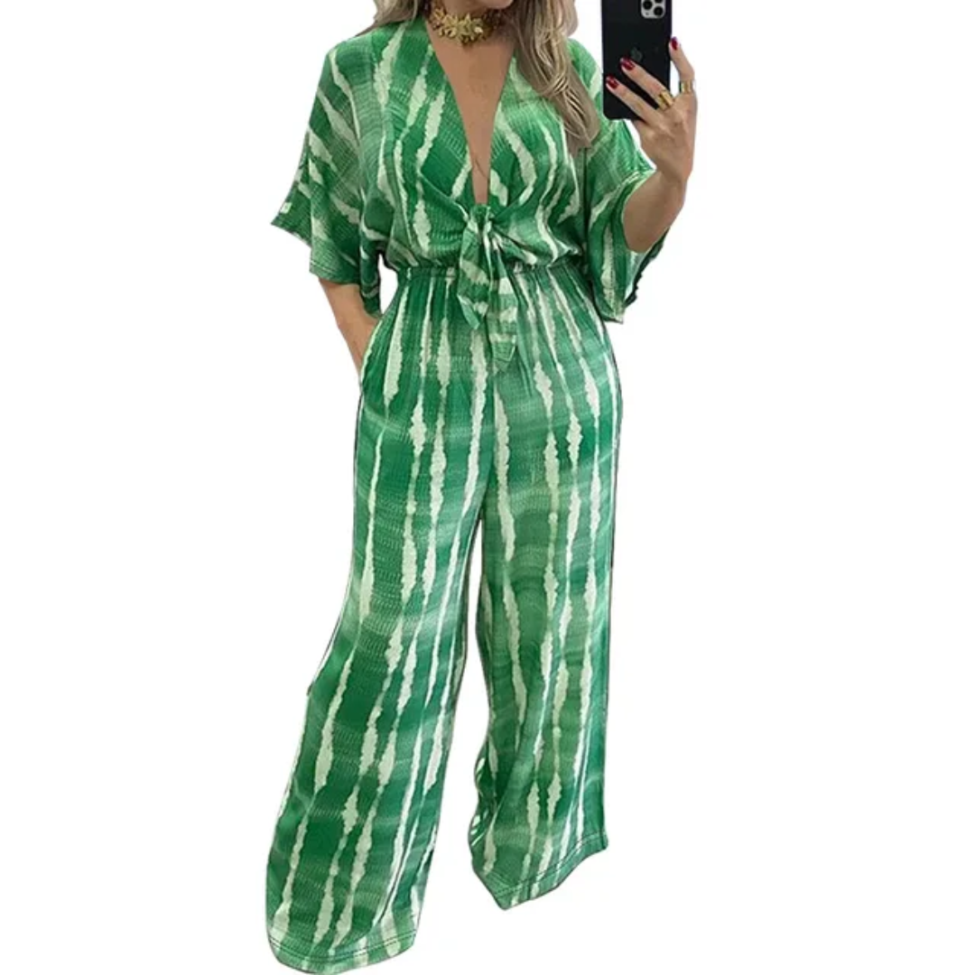 Macacão com decote em V, mangas médias e cintura elástica. 223